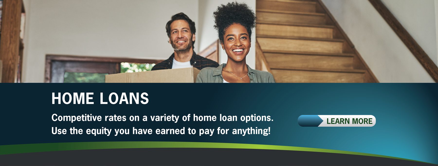 Two people holding a box, standing by stairs, smiling. Text about competitive home loans with an option to learn more. Cozy, home-like setting.